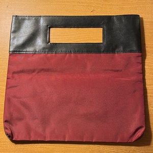 Clutch-style 2-toned Elizabeth Arden handbag.